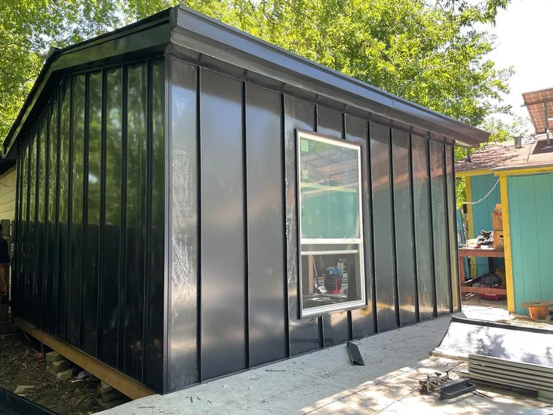 Black standing seam metal wall panels for Roof Inspection in Citrus Springs