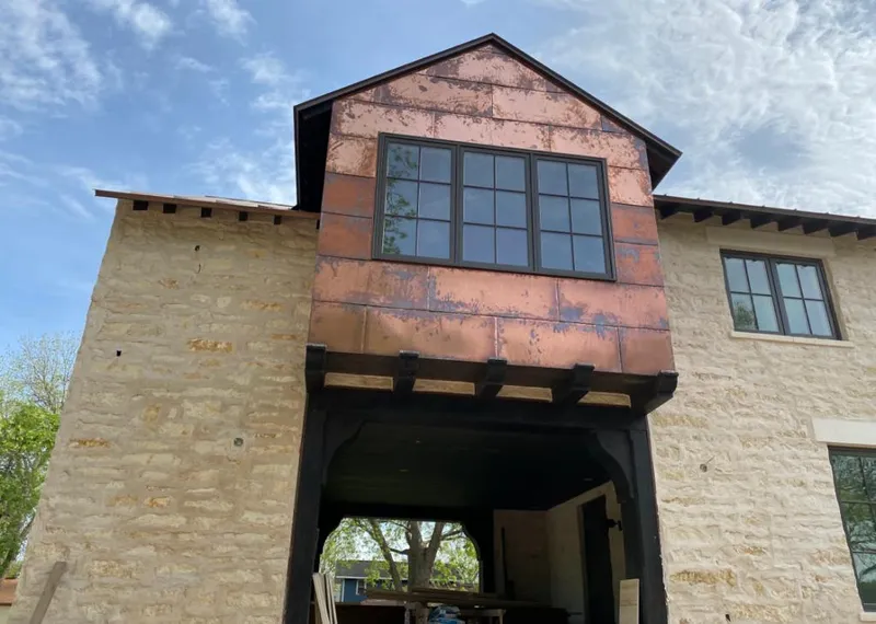 Copper metal panel facade on a stone building for Metal Roof Coating in Citrus Springs