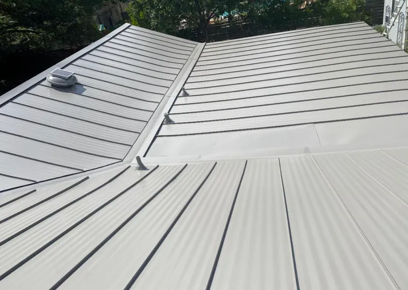 Solar attic fan installed on a metal roof for Roof Ventilation in Citrus Springs